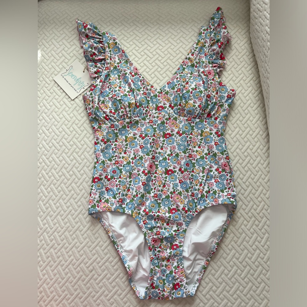 NWT women’s size small floral one piece swimsuit.